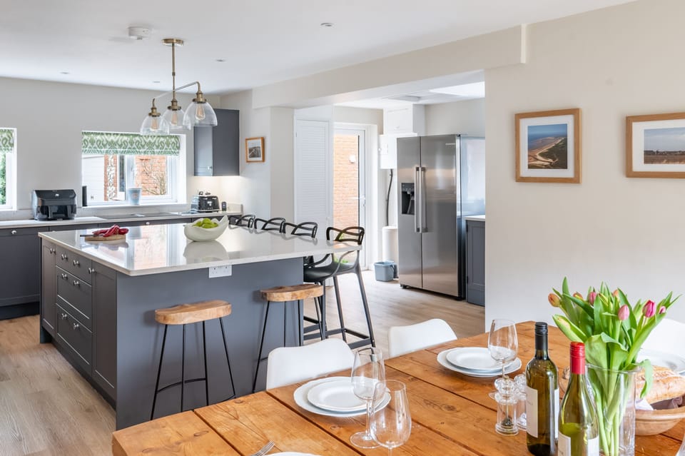 Ground floor: Large kitchen and dining table, with access to the dining patio