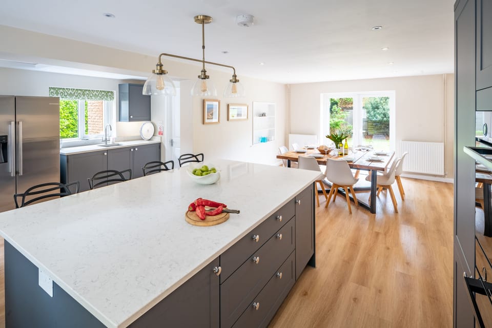 Ground floor: Large kitchen and dining table, with access to the dining patio