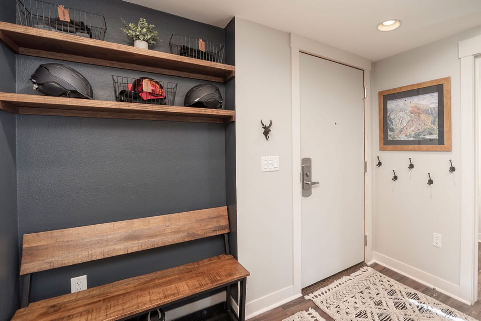 Your adventure starts here with a welcoming mudroom designed for skiers and outdoor enthusiasts. Store helmets and gear on custom shelving while coats hang ready for tomorrow's mountain escape.