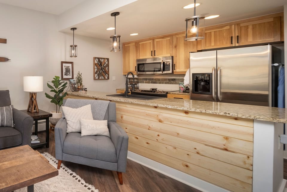 Settle in and enjoy your fully equipped kitchen with granite counters, stainless appliances, and a cozy open living space—perfect for home-cooked meals and relaxing evenings.