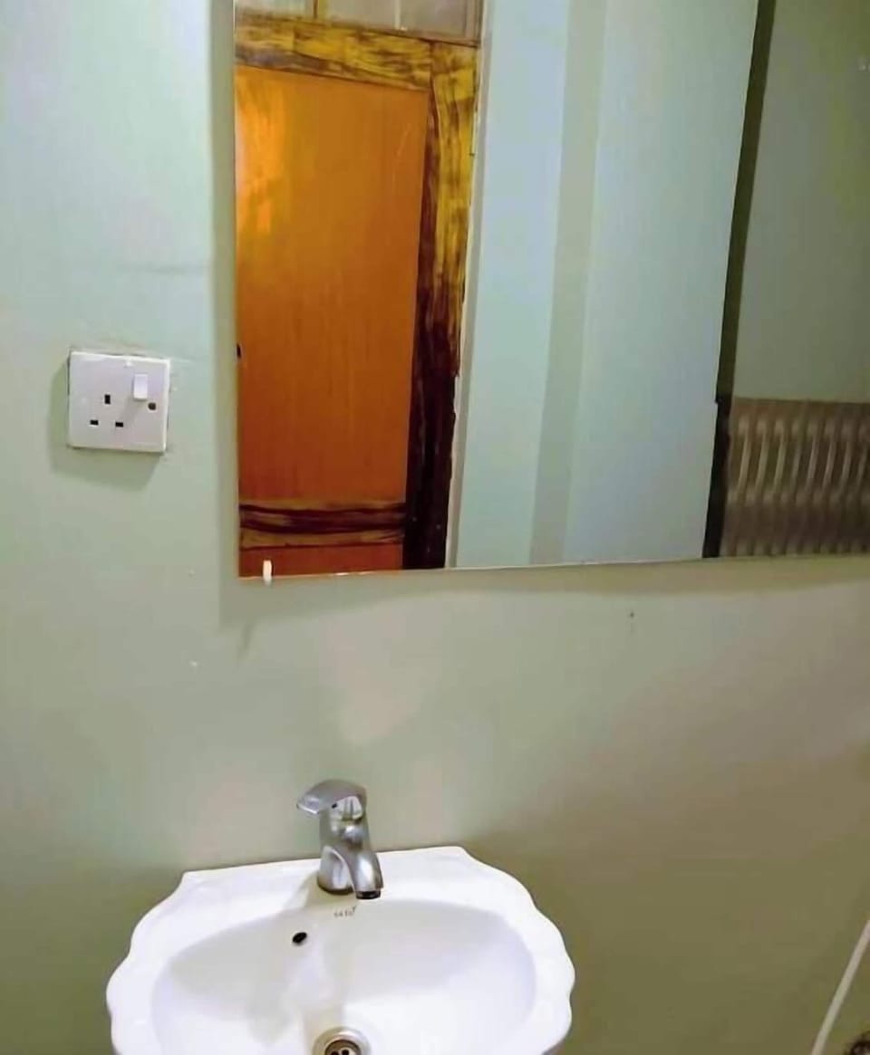 Shower, hair dryer, slippers, towels