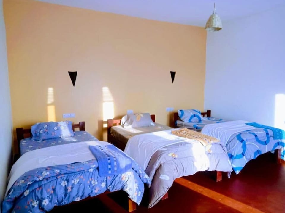 Superior Triple Room, Patio, Lake View | In-room safe, desk, laptop workspace, bed sheets