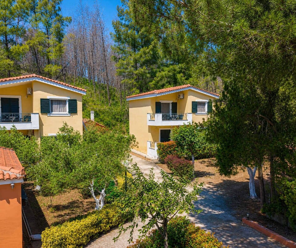 Property view surrounded by lush greenery and peaceful nature, offering a quiet and relaxing environment