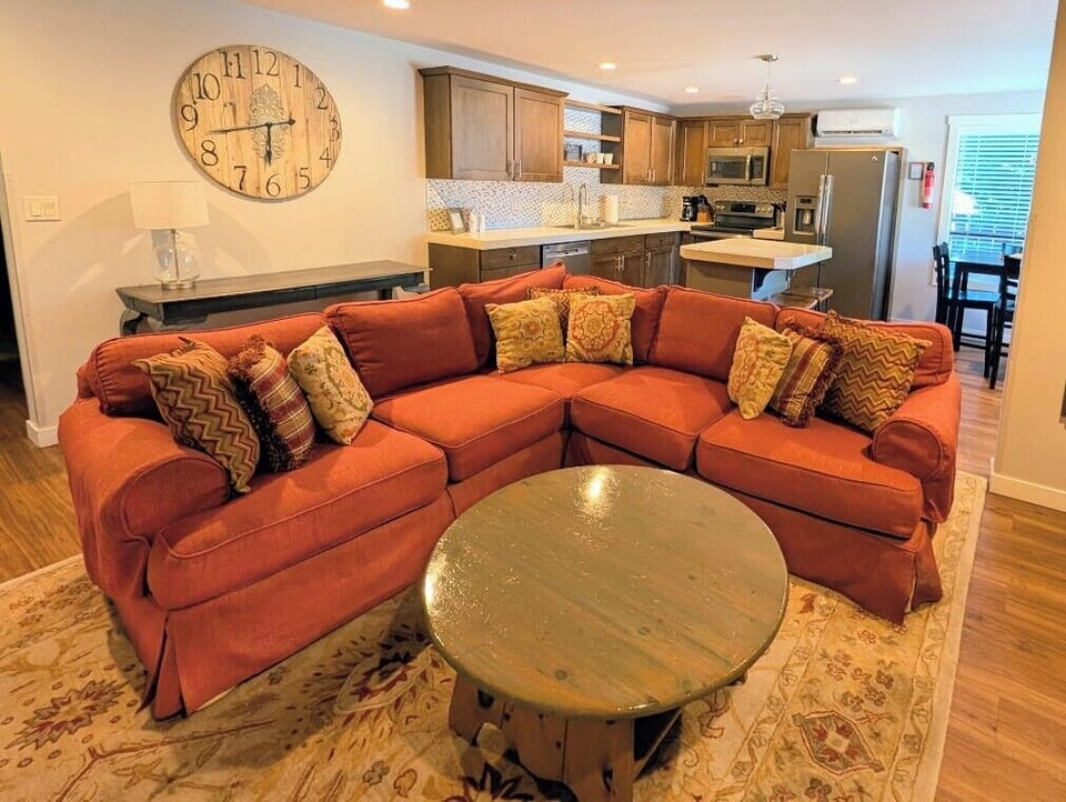 Large open concept living, dining & kitchen with ample seating.