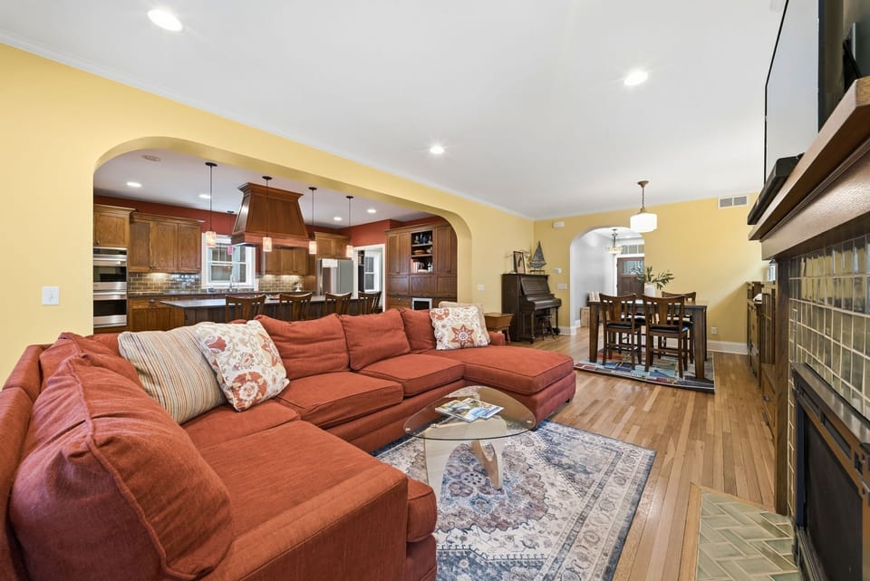 Sink into the plush sectional and enjoy the open-concept layout connecting your living space, fully equipped kitchen, and dining area—perfect for gathering with family.