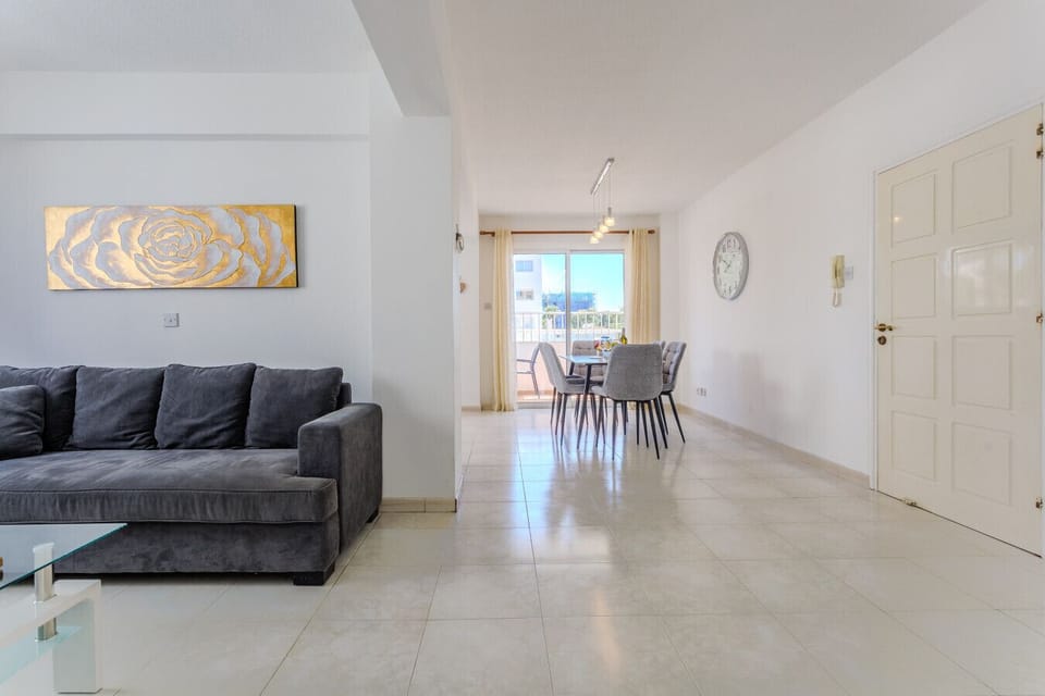 The living room and kitchen feature a large open space, creating a bright and comfortable area for relaxing and enjoying your stay.