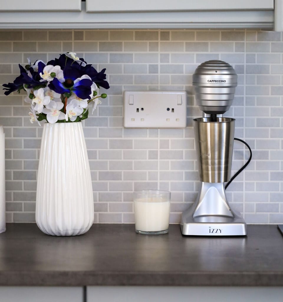 Enjoy fresh coffee anytime with the coffee machine, including frappe preparation.