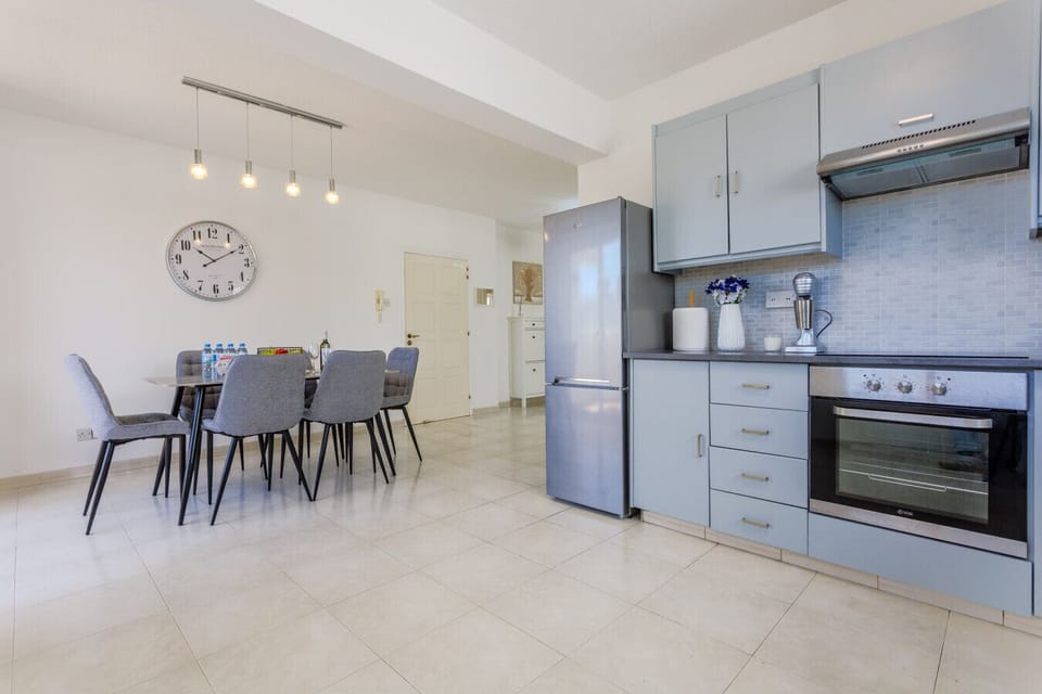 Perfect setup with a fully equipped kitchen and stylish dining table.