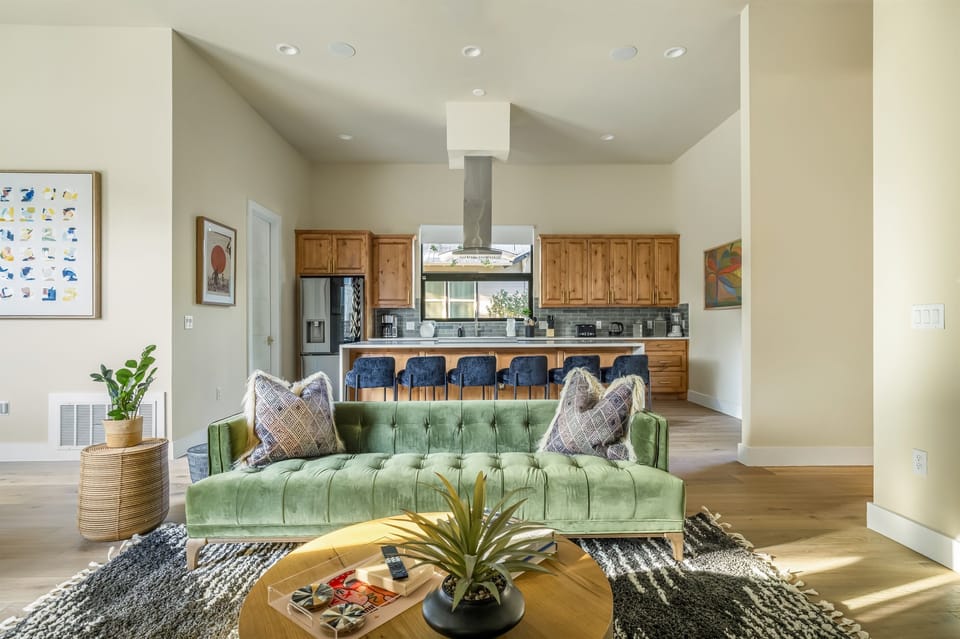 Luxury open-concept living area with spacious seating, contemporary design, and a bright inviting atmosphere ideal for families, friends, and group trips.