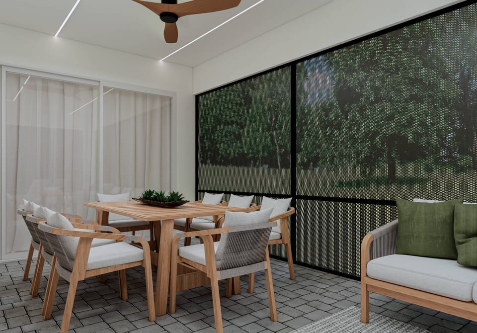 Join us at the beautifully crafted wooden table with comfy seating and soft green pillows. Enjoy the warm atmosphere as natural light flows through the sheer curtains, bringing the lush outdoor view right to your gathering.