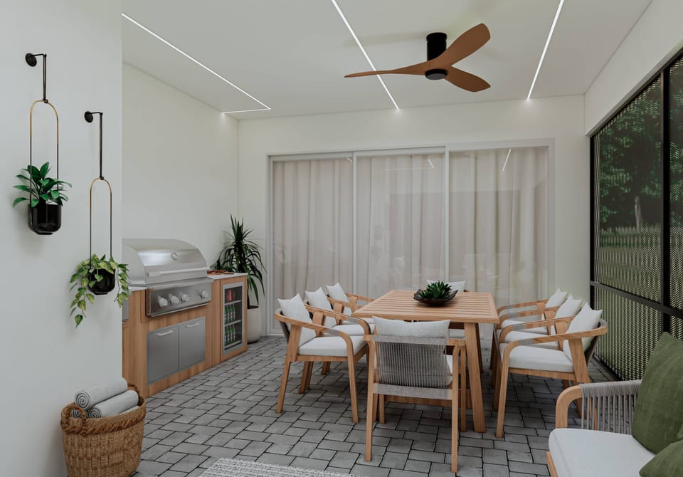 Savor alfresco dining in this lovely space, with a stylish wooden table and comfy chairs bathed in natural light from large glass doors. A modern ceiling fan adds comfort, while potted plants create an inviting ambiance.