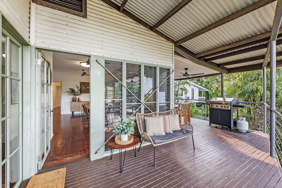 Spend time outdoors in the backyard where open lawn and greenery create a peaceful retreat.