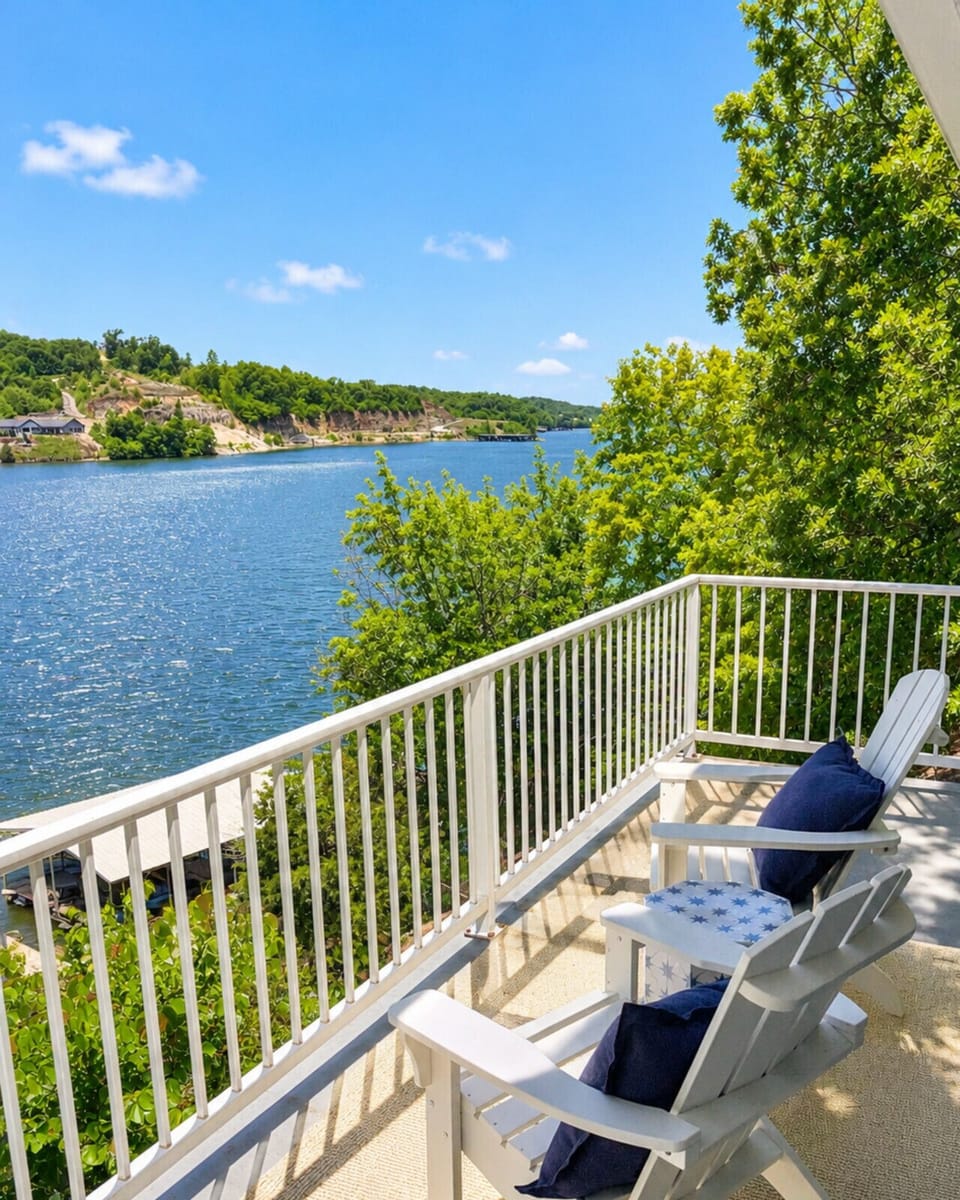 Start your day right with a warm cup of coffee on the deck, featuring beautiful lakefront scenery.