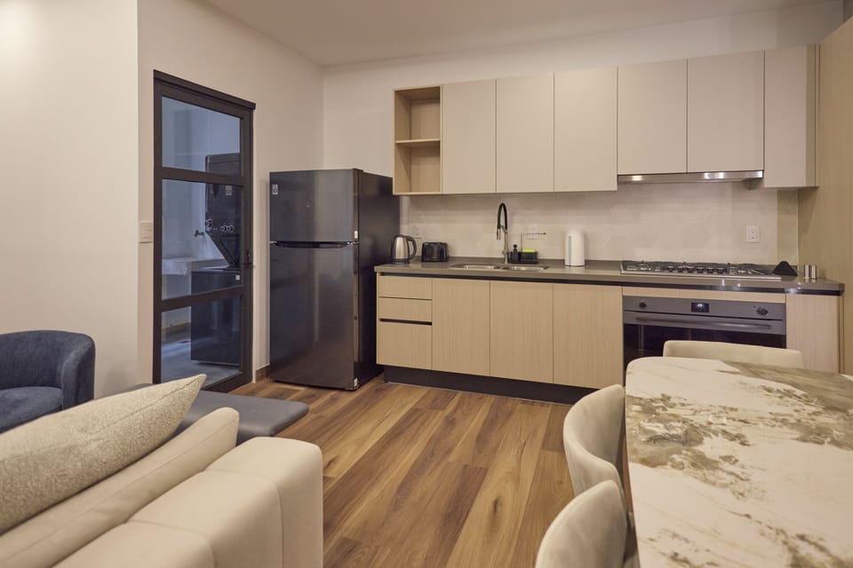 Luxury Studio | Private kitchen | Fridge, oven, cookware/dishes/utensils
