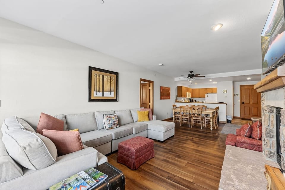 Living room with fireplace, smart tv and stunning mountain views