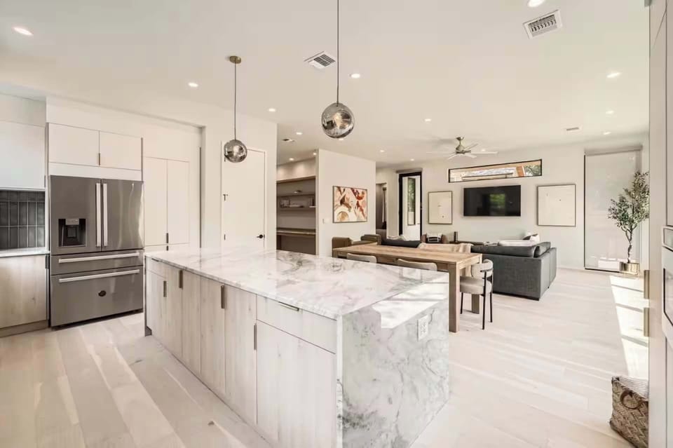 A bright, open-concept kitchen flows seamlessly into the dining area for effortless entertaining.
