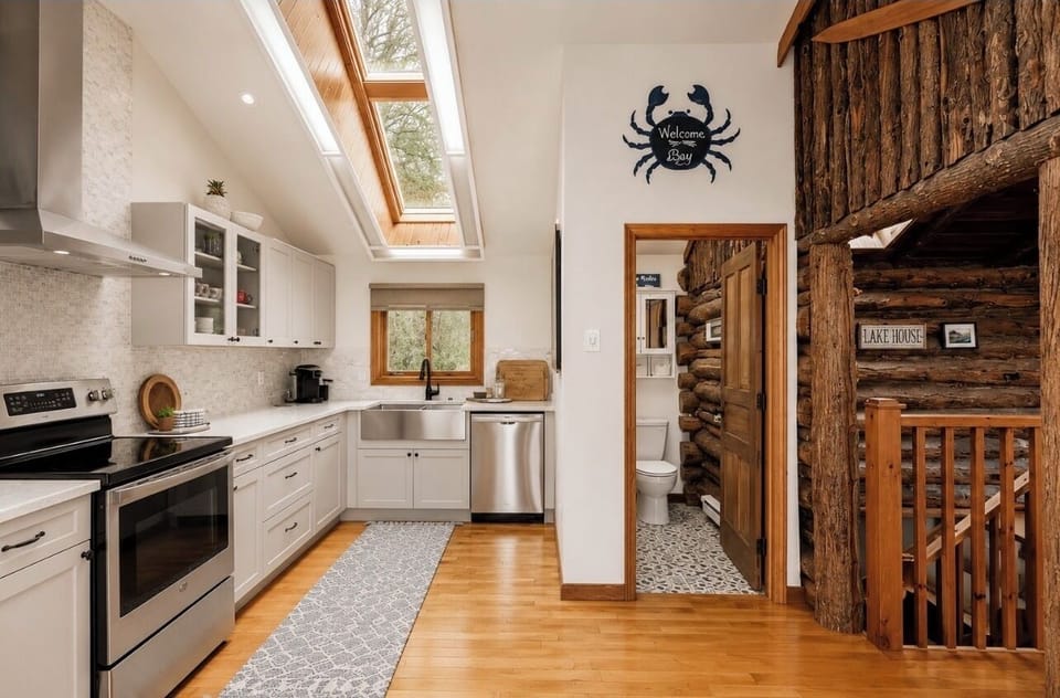     Bright, fully equipped kitchen with skylights and modern appliances.