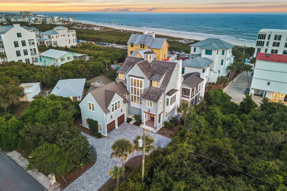 Stunning beachside estate nestled in a coastal neighborhood, with ocean views and lush natural surroundings just steps from the shore.