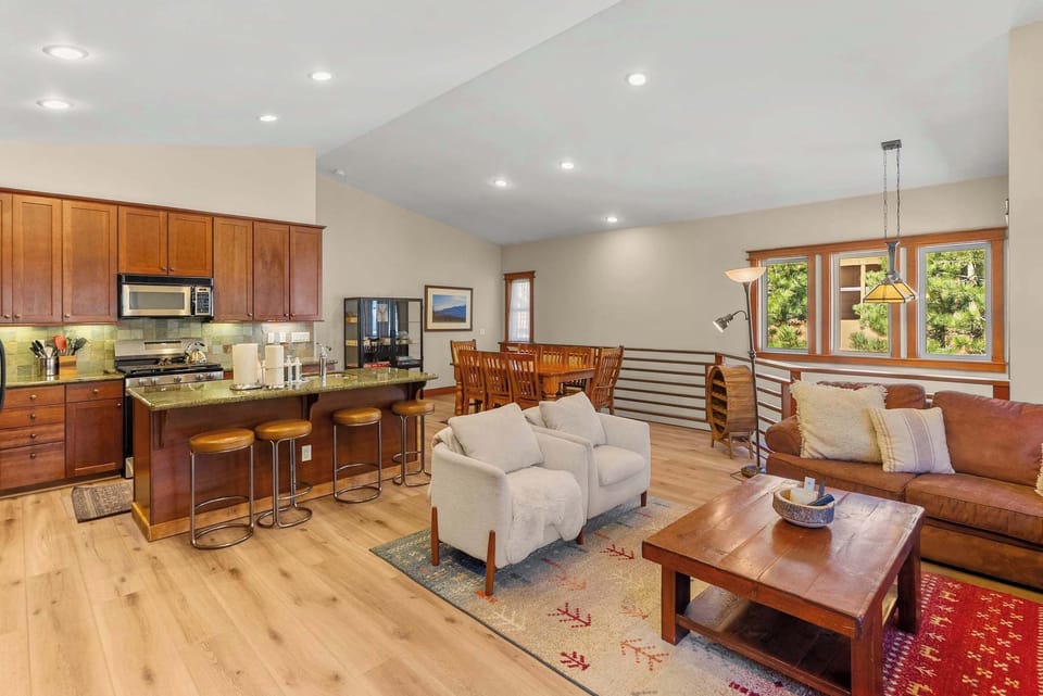 Open living room w/ fireplace & flat-screen TV