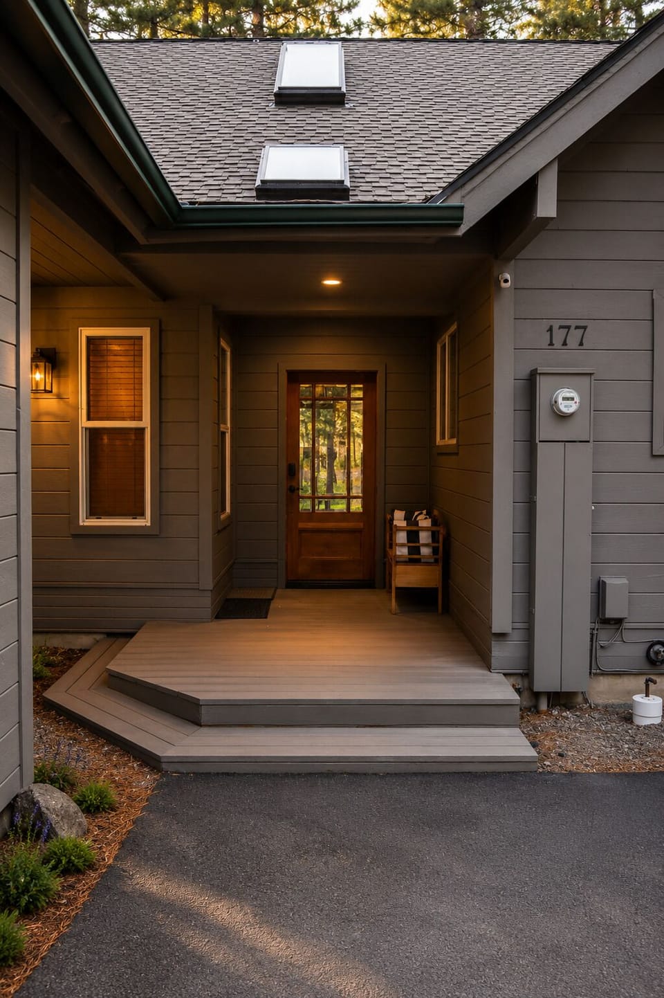 Welcome to unit 177—a cozy, modern retreat nestled among towering pines. The warm glow from the covered entrance sets the tone for your perfect getaway.