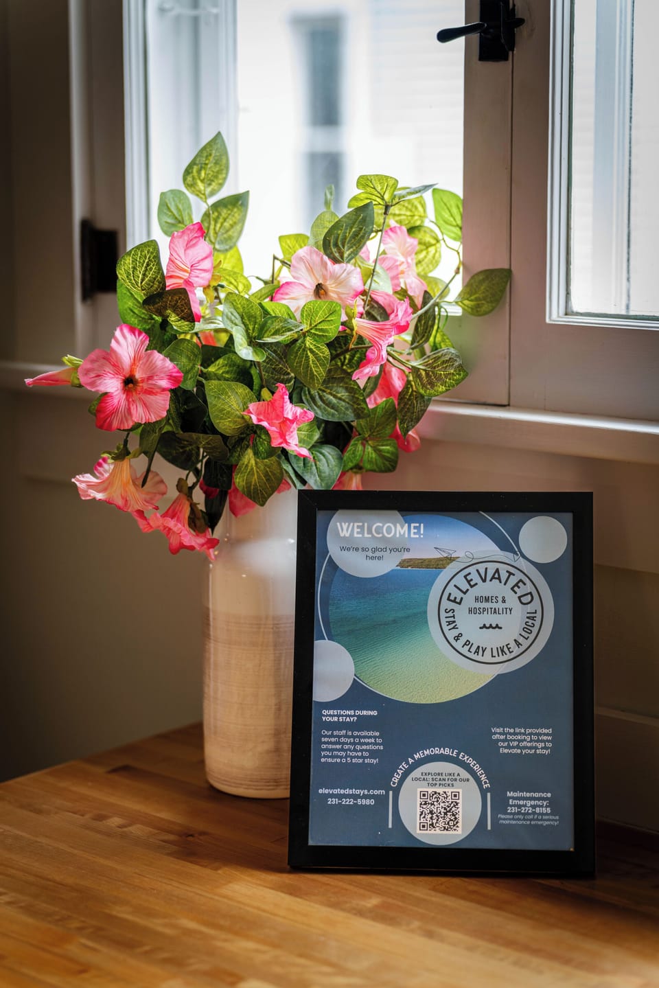 Thoughtful welcome setup with fresh floral decor and guest information, creating a warm and inviting arrival experience.