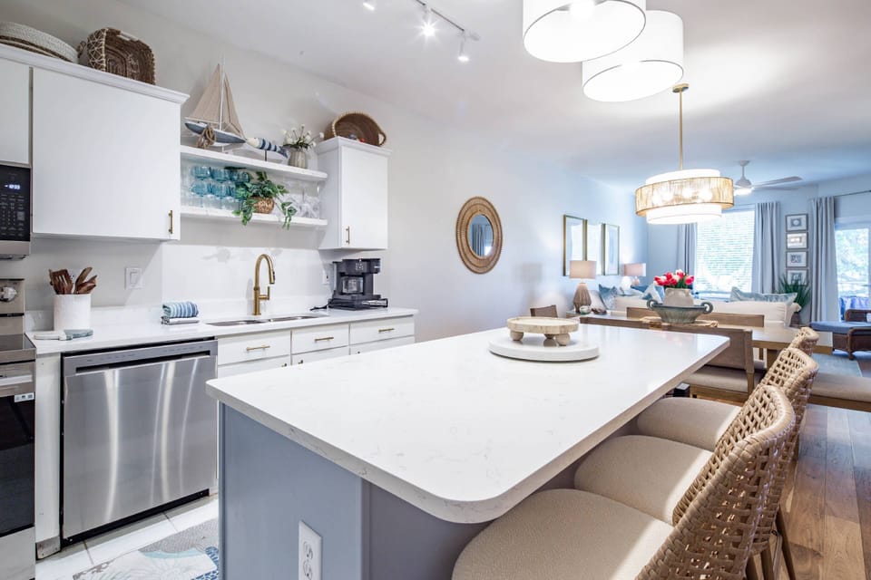 There are three stools at the kitchen island.