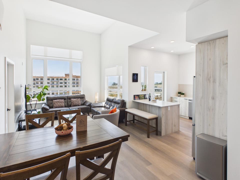 Perfect for entertaining—the seamless flow between the living room, dining zone, and kitchen makes hosting a breeze.