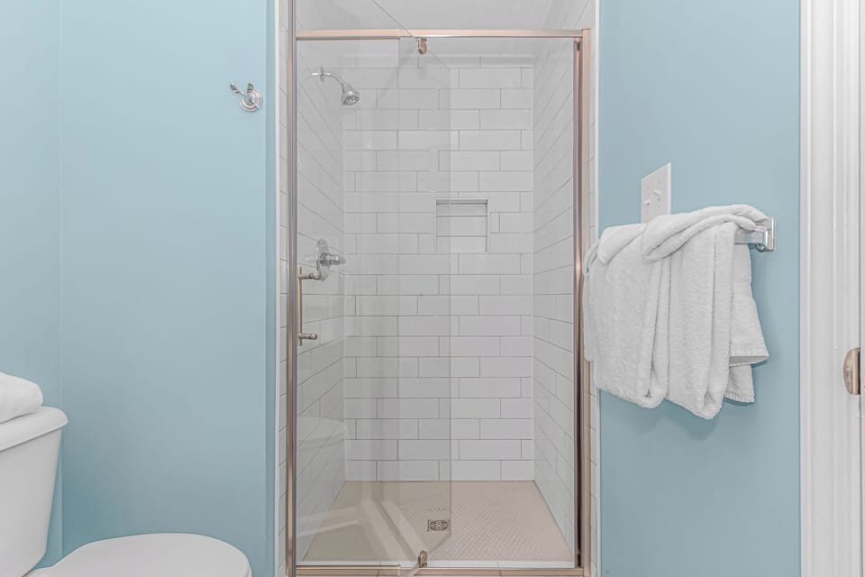 Walk-in shower in the second bathroom.