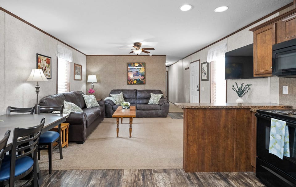 Open concept lounge ready living room with 50" TV.