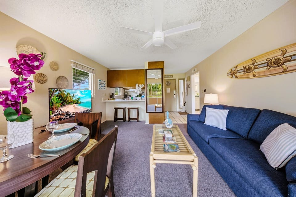 Surf art, island vibes, and a sofa bed ready for your best night's sleep.