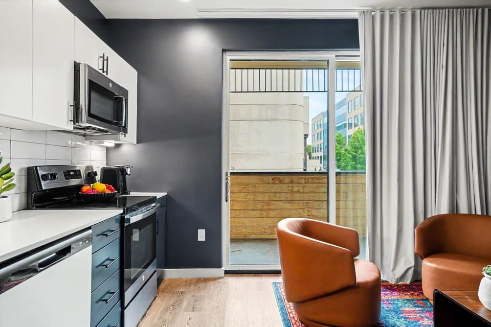 Modern kitchen with sleek finishes, stainless steel appliances, and everything you need for easy meals, morning coffee, or drinks before a night out in Nashville.