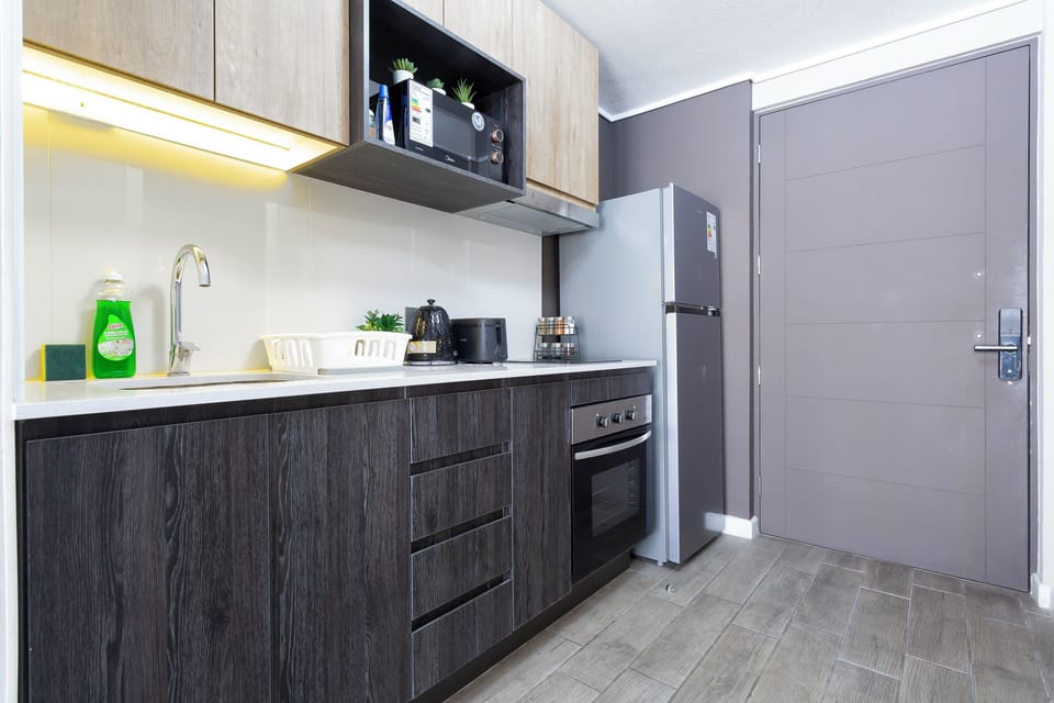 Apartment | Private kitchen | Full-size fridge, microwave, stovetop, cookware/dishes/utensils