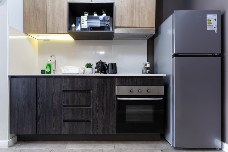 Apartment | Private kitchen | Full-size fridge, microwave, stovetop, cookware/dishes/utensils