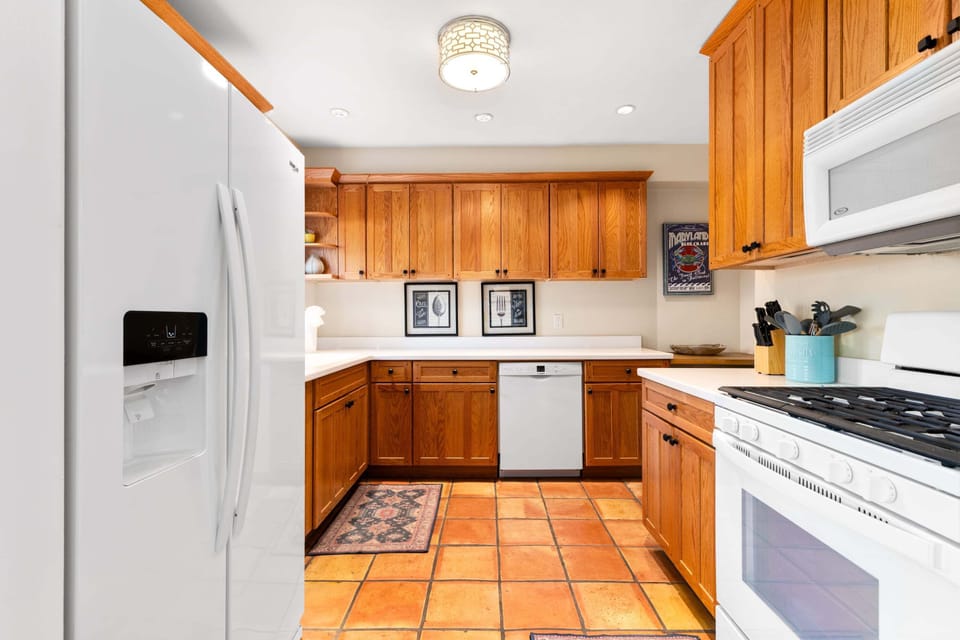 Located just off the dining room, equipped with cooking essentials.