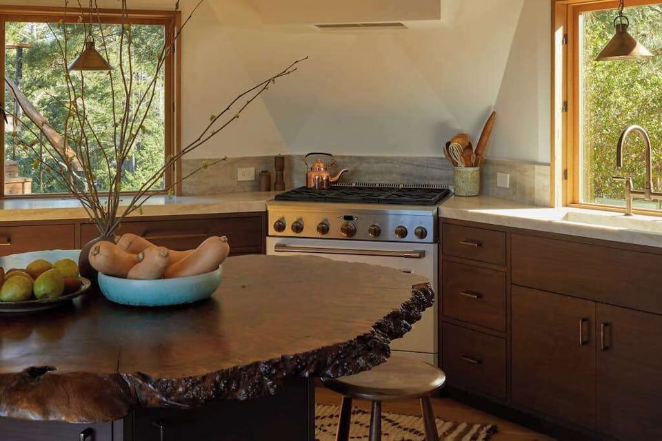 Experience the harmony of nature and style in this well-appointed kitchen, where culinary creativity meets the beauty of the outdoors.