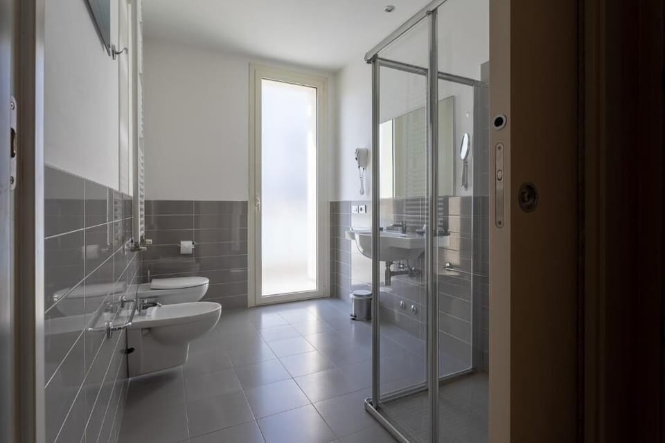 Superior Quadruple Room, Multiple Beds, Partial Sea View | Bathroom | Shower, hair dryer, bidet, towels