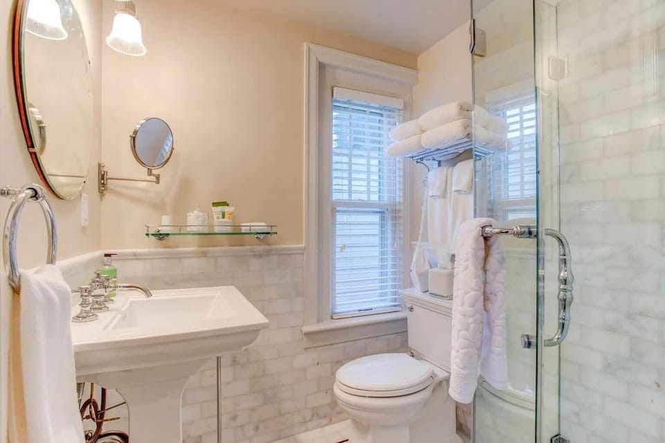 The Teddy & Edith Room  | Bathroom | Shower, hair dryer, slippers, towels