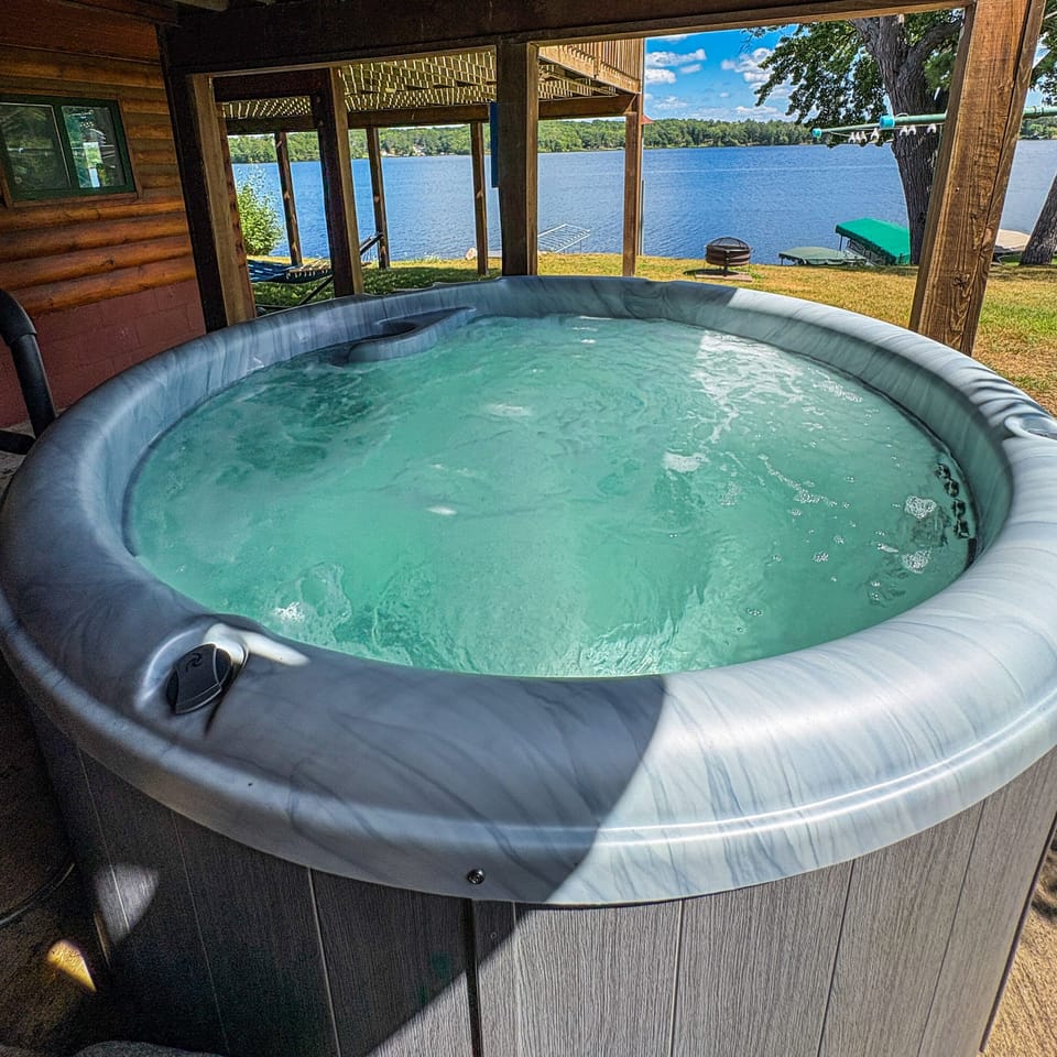 Soak in the exterior hot tub while taking in the view of beautiful Rice Lake. 
