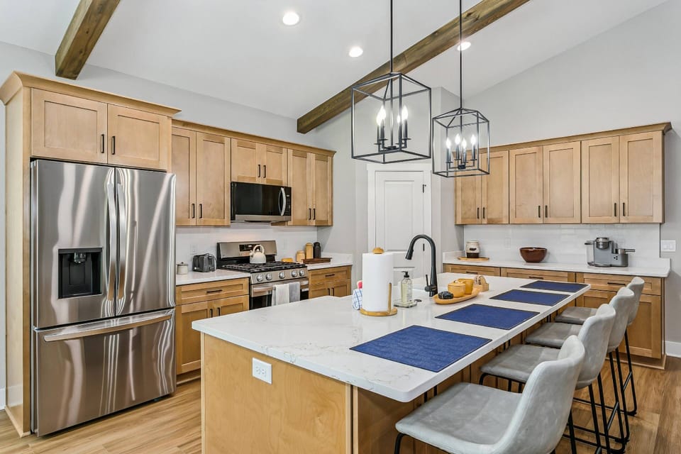 The huge kitchen island has seating for 4 and it the perfect lunch spot