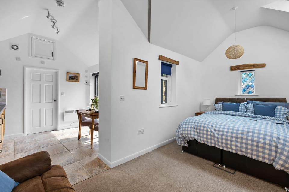 Double bed, bedside tables and arm chair - The Granary
