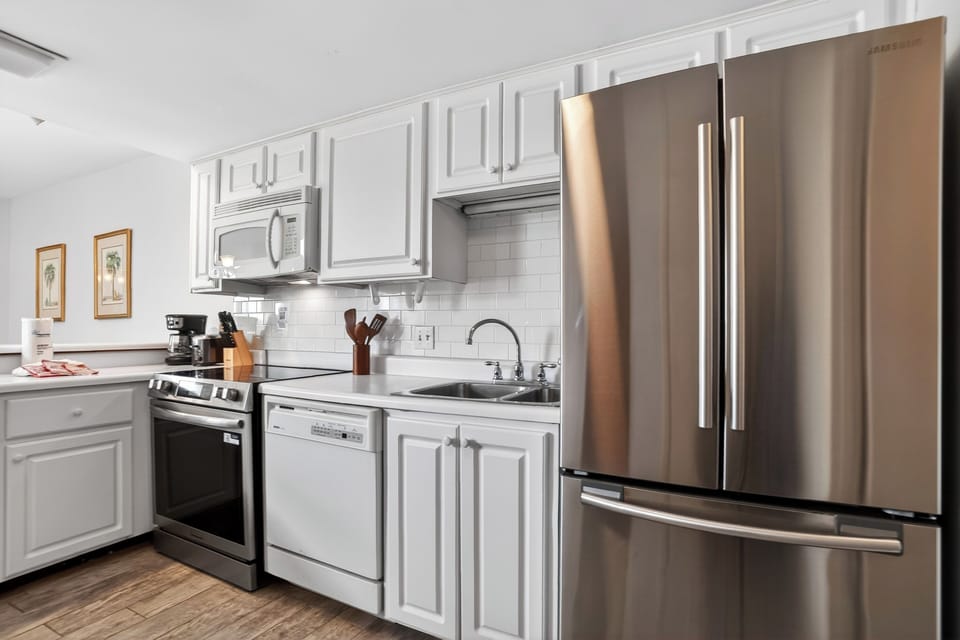 Clean, fully equipped kitchen with stainless steel appliances and plenty of counter space for easy meals.