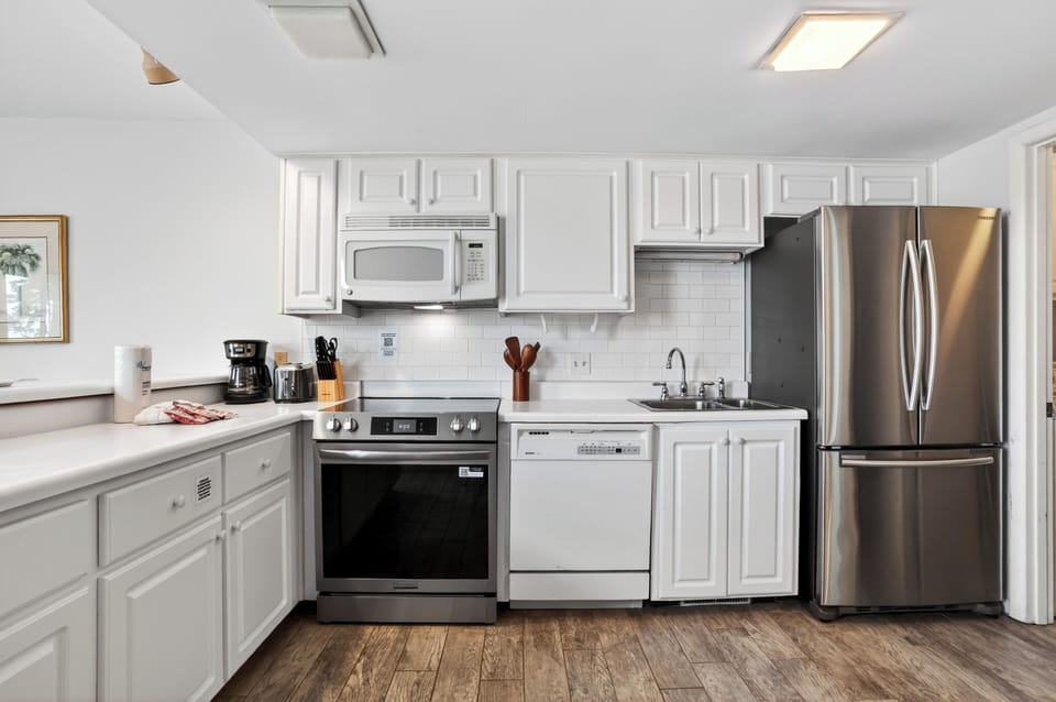 Clean, fully equipped kitchen with stainless steel appliances and plenty of counter space for easy meals.