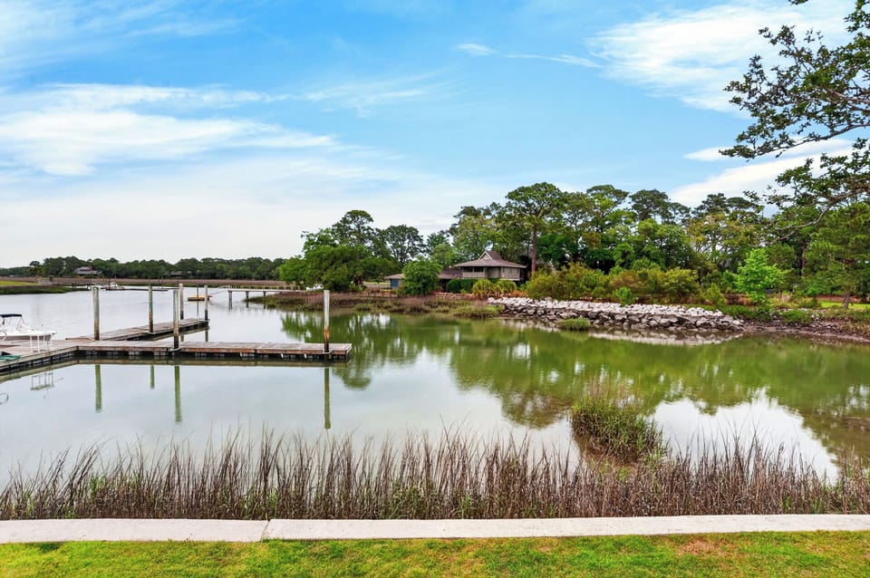 Peaceful waterfront setting with calm lagoon views, private docks, and a true laid-back coastal atmosphere.