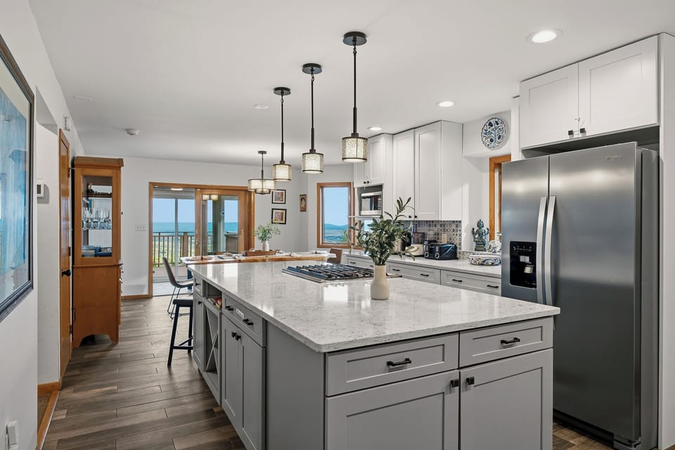 Modern kitchen with a spacious island, gas cooktop, and sleek finishes for easy group meals.