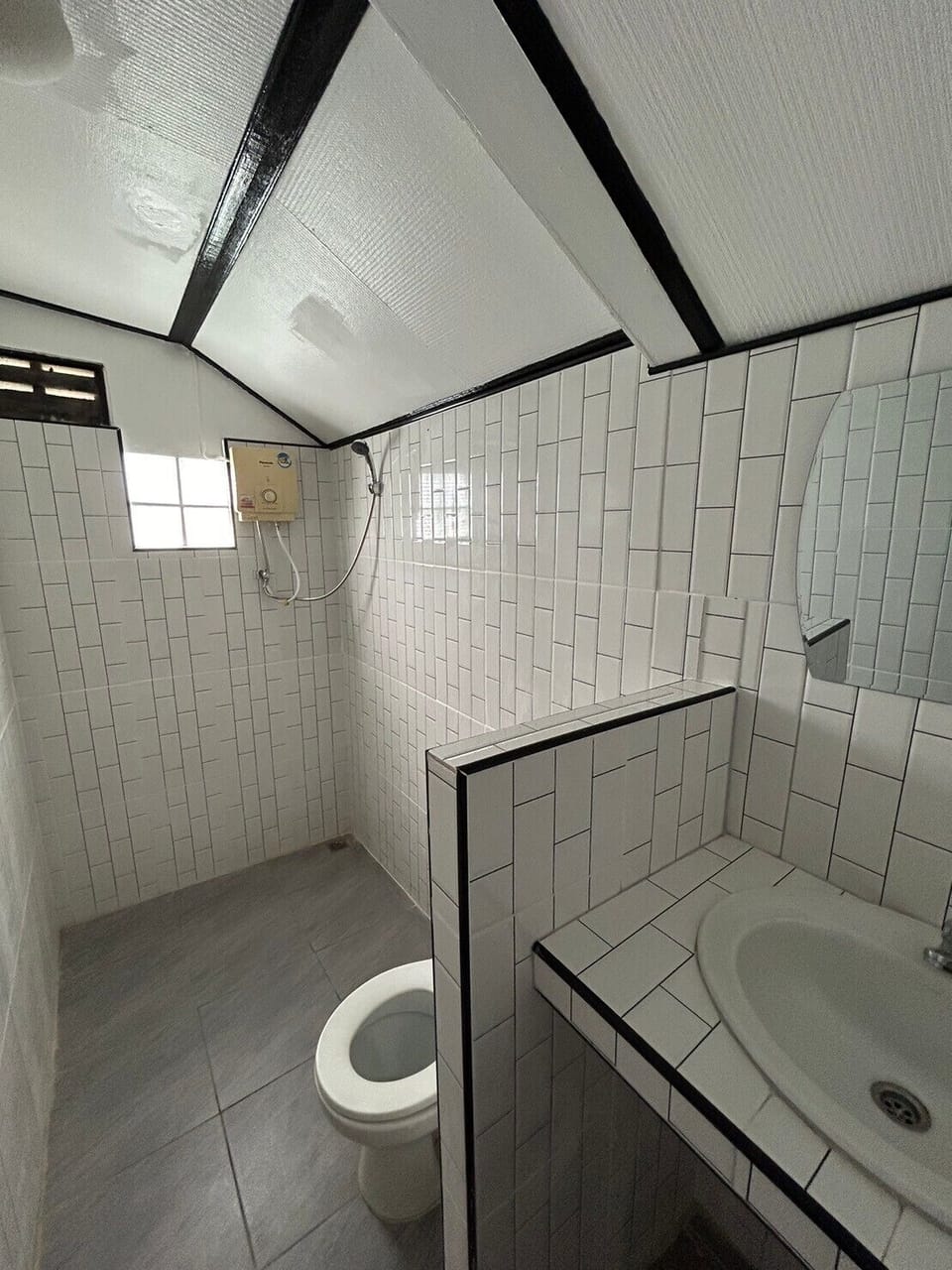 Basic Studio | Bathroom | Shower, towels, soap, toilet paper