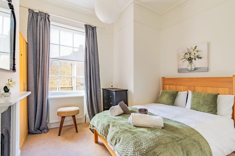 Comfy double bed with view over the courtyard 
