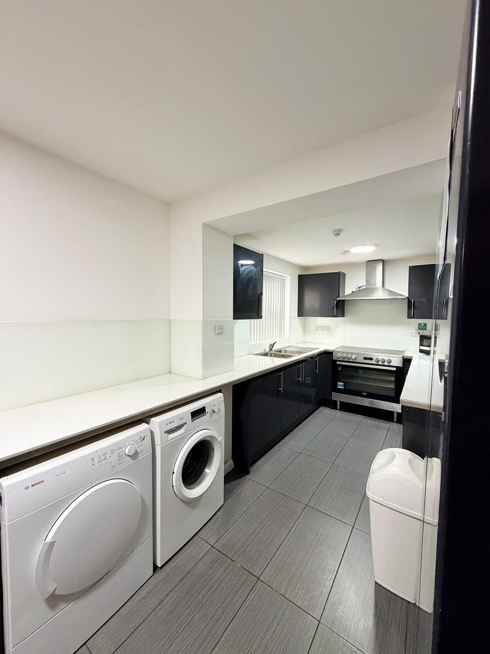 Full-size fridge, microwave, oven, cookware/dishes/utensils