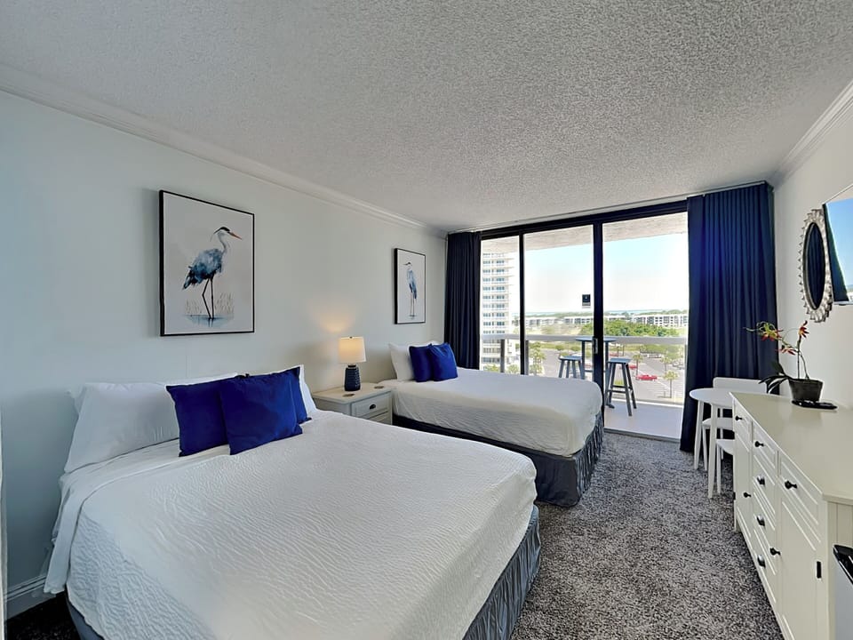 Sleeping Area - Two Queen Beds + Private Balcony Access