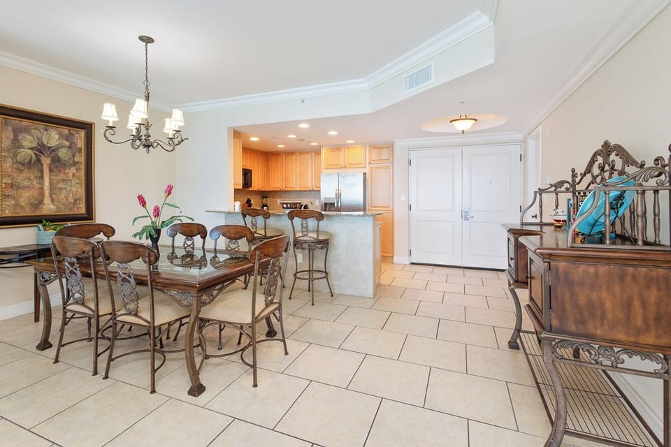Step into your spacious, light-filled home away from home, where tropical elegance meets modern comfort. The open layout flows from dining to kitchen, inviting you to relax and unwind in style.