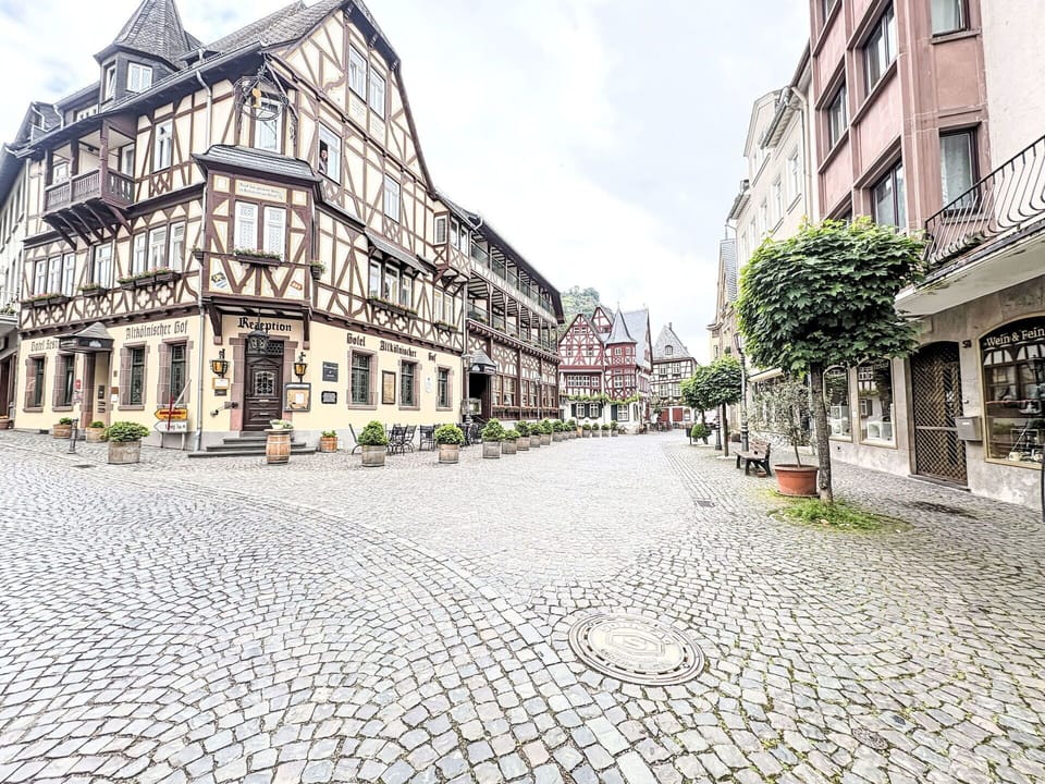 Building, Road Surface, Window, Urban Area, City, Town, Street, Facade, Road, Neighbourhood